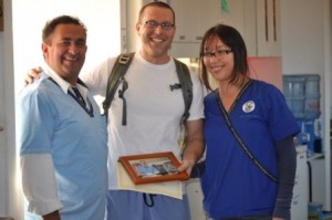 Dr. Todd Pizzi (center) poses with Dr. Hector Aguilar, clinic manager, and Vivian Garcia, assistant clinic manager at the Peronia Open Wide Clinic. (Photo/submitted)