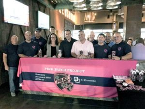 Members of the Patrol Officers Union NEPBA Local 191 with 15-40 Connection’s Helene Winn and David Faucher (in pink) Photo/Melanie Petrucci