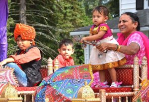 Multi-generational participants of the Shrewsbury-based India Society of Worcester ride the float that was awarded first place. Photos/Ed Karvoski Jr.