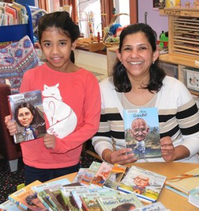 Shamika Kanitkar, 9, and her mother Seema display books purchased with a donation to the Shrewsbury Public Library. Photo/Ed Karvoski Jr. 