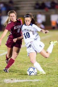 Shrewsbury’s Kathryn Cawley (#19) prepares to pass to keep the ball away from Algonquin’s Caroline McAndrews (#2).