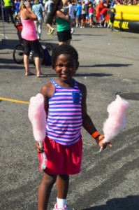 Michelle Kasa, 5, has her hands full of cotton candy. 