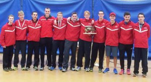 The Saint John’s cross country team with the Division 1 Central Mass. championship trophy