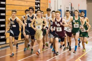 Runners jockey for position at the start of the boys 2 mile run. 