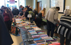 Patrons peruse the many offerings at the Friends of the Shrewsbury Public Library’s Annual Used Book Sale April 5. Hundreds of visitors of all ages took the opportunity April 5-8 to stock up on their reading materials. Photo/Heidi Hayes-Pandey