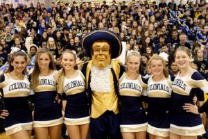 The school's mascot poses for a shot with some of the cheerleaders. 
