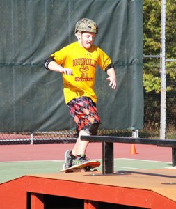 Sixth-grader Chris Carrearas skateboards up a ramp.