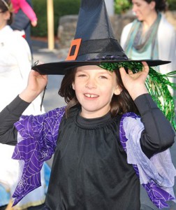Maggie Fitzgerald, 7, holds onto her witch hat. 