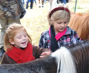 Annabel Blanchard, 4, and her sister Georgieanna, 7, pet a pony from the Woodville Trailbusters 4H Club in Hopkinton.