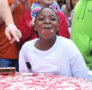 Zinna Green, 9, is declared winner of the pie eating contest in the age 7 to 9 category and wins two VIP movie tickets to Regal Cinemas. Other age categories were 10 to 12, and 13 to 15.