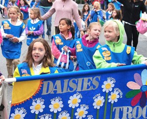 Members of Daisies Troop 69242 march in the parade.