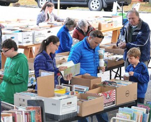 Shoppers of all ages browse the book sale offered by the Friends of the Southborough Library.