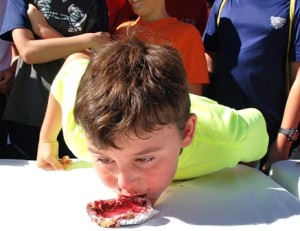 Matt Ansaldi, 9, munches his way toward winning the pie eating contest in the age 8 to 10 category. The contest was organized by Boy Scout Troop 92. 