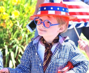 “Harry Potter” fan C.J. Cryan, 5, marches along the parade route.