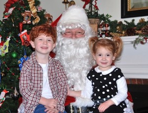 Wesley Sabel, 4, and his sister Violet, 2, meet Santa at the Community House.