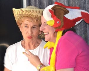 Terry Sganga and her daughter, Joanna, sport silly headwear while posing in a photo booth.