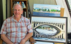 Shrewsbury artist Lenny Wos poses with two of his rowing paintings. “Rowing Home,” on the bottom, took second place in a juried art show. (Photo/Joyce DeWallace)