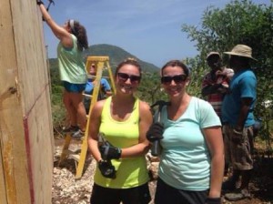 (l-r) Meghan and Katrina Foley work on building a house for a local family during their trip to the Be Like Brit Orphanage in Haiti.