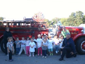 Children at the First Steps Learning Center in Hudson with teachers and firefighter Rich Hubert. (Photo/submitted)