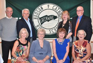 Gathered around an authentic “Green Wave” banner at the 50-year reunion of the Hudson Catholic High School class of 1964 are the reunion planning committee members (back, l to r) Ed Lambert, Charlie Hellen, Rita (Bissonnette) Clark, Billy Tate, (front, l to r) Nancy (Montecalvo) McCarthy, Terry (Duggan) Maher, Mary (Adams) Ketola and Dianne (Borowski) Moore.  Photo/Ed Karvoski Jr. 