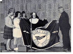 Displaying a “Green Wave” banner at a 1964 Hudson Catholic High School pep rally are (l to r) the Homecoming Queen, Kathy (Sawyer) Tucci, cheerleaders Joan (Curley) Jameson and Nancy (Montecalvo) McCarthy, with Sister Superior Rita Marie and Monsignor Llewellyn D. Chadbourne. Photo/submitted 