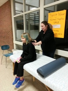 Nurse Kara Joniaux gives a student a relaxing massage