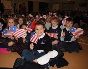 Kindergarten student, Isabella Urbani, and her peers enjoy the assembly.
