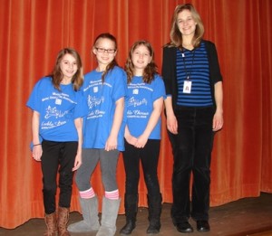 (l to r) Ally Cashin, Michaela Berk, and Kerri Walsh, with their music teacher, Katrina Whalen, show off their special t-shirts they wore as part of the All-State Treble Chorus . Missing from photo is student Colleen Mulligan.  Photo/Nance Ebert  