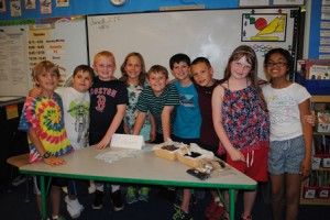 Gathered at the table representing the Northeast with chocolate and dried blueberries are fourth-grade students Marc Gadbois, Jayson Michaud, Thomas Zelnick, Amanda Dunsmore, Daniel Boush, Ryan O'Connor, A.J. Guidi, Laura Calef and Norah Shaikh.