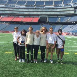 Sherwood sixth graders Dylan LeMay, Vidyut Veedgav, Madeline Duke, Kate Hitchcock, Megan Albertson, Ann Titus, Aishwarya Narayanan and Zaineb Irfan take to the field at Gillette Stadium after presenting on a variety of tech projects at the recent MassCUE technology conference.