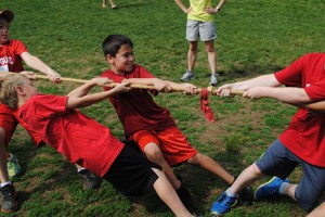 Third-grader Brendan Estaphan participates in a tug of war. 