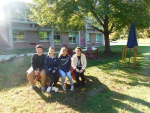 (l to r) Jack McGinn, Emma West, Miara Sasdi and Nicholas Smaldone in the outdoor classroom. Photo/Bonnie Adams