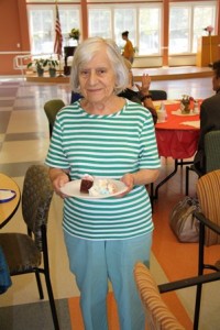 Agnes Sagerian helps to pass out birthday cake. Sagerian has been volunteering at the Northborough Senior Center for over 18 years.