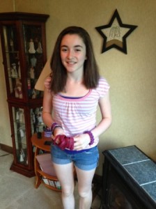 Alannah Laurence displays some of the bracelets she sold to raise money for her cousin. Photo/Valerie Franchi 
