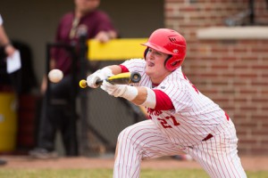 St. John’s Alex Black bunts in the sixth inning in a frame against Algonquin.