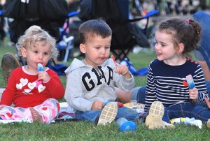 Mia Guarino, 1, Cameron Cosman, 2, and Madison Guarino, 3, enjoy ice cream treats during intermission.