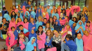 Blue blankets for boys and pink for girls are part of the costumes for the infant stage of the upcoming production “The Edge of the Nest” by Sherwood Middle School students. (Photo/submitted)