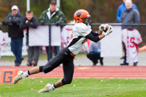 Marlborough’s Vincenzo DiMauro (#82) couldn’t quite hang on to the ball as he dives into the end zone to make a catch.