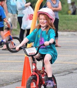 Madeline Spinney, 5, of Grafton takes another lap around the mini loop. (Photos/Ed Karvoski Jr.)