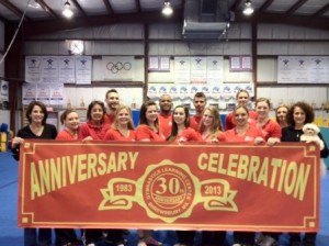 Some of GLC's staff celebrating 30 years of excellence in gymnastics.