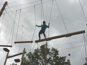 Ashley Lynch navigates through Shrewsbury High School's rope course.