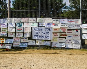 Homemade signs thank the many sponsors of the tournament.