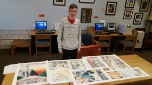 Shrewsbury High School senior Liam Monahan with some of his artwork. (Photo/Heidi Hayes-Pandey)