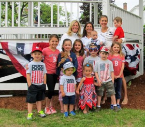 The Kapustas, the Healds and their puppy Buddy, the O’Connors, the Gangars and the Samaras gather to watch the parade. 