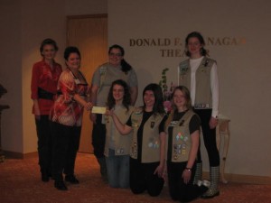 N.E.T.Works Productions Director Holly Dion, second from left, presents a check to Girl Scout Troop 31331. (Photo/submitted)