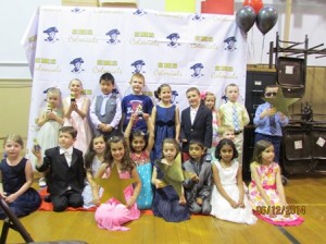The Beal Early Childhood Center's kindergarten class at the photo booth with their awards.