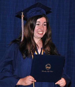 Michaella Petrucci displays her diploma.