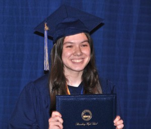 Madeline Cherniack displays her diploma.
