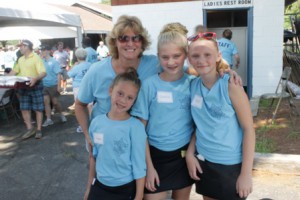 Lynn Trudel, a Hudson resident and chief deputy at the Civil Process Office, volunteered at the picnic with her daughters Amanda (left), Danielle (center), and friend Tessa Wing.