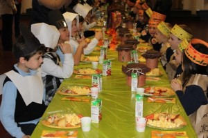 Students in kindergarten and first grade at St. Mary's School in Shrewsbury share a Thanksgiving feast as pilgrims and Native Americans. (Photo/submitted)